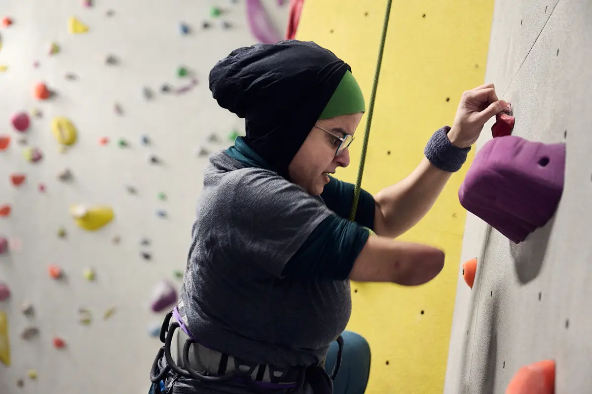 Disabled amputee using a climbing wall