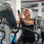 Older person using gym equipment