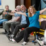 group taking part in chair bases exercise