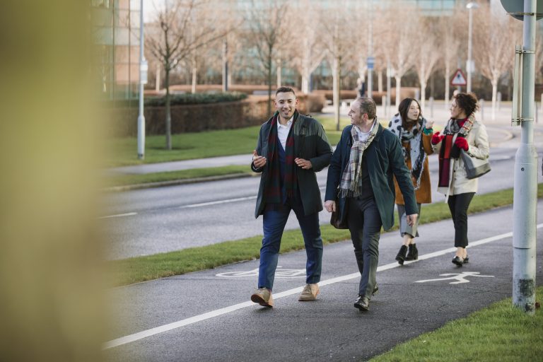 Businesspeople are walking to work in the city.