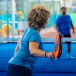 A woman plays padel