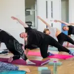A Pilates class stretches