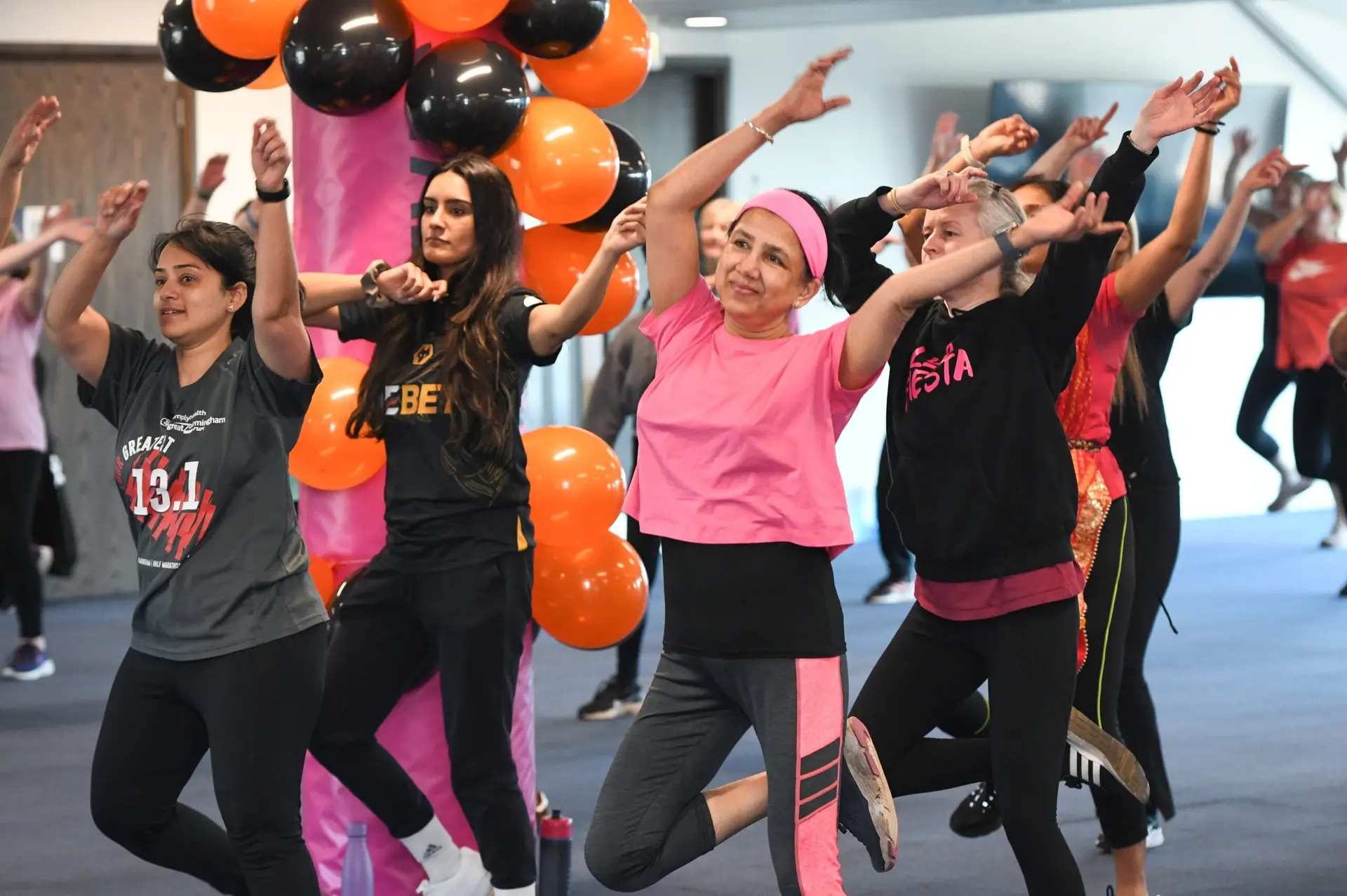 Participants dancing during a BBX Fitness class.