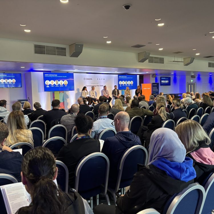 A panel session takes place on stage at the CIMSPA conference